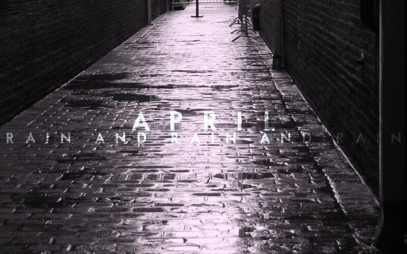 April rain on cobblestone alley