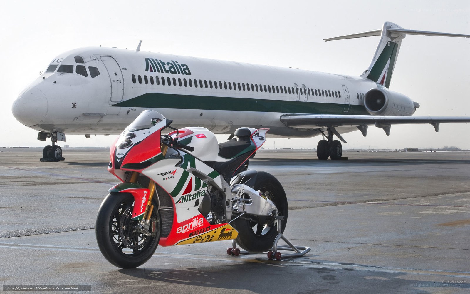 Aprilia motorcycle with Alitalia plane