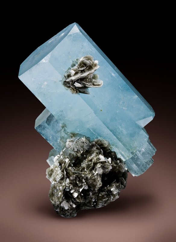 Aquamarine crystal with mineral cluster