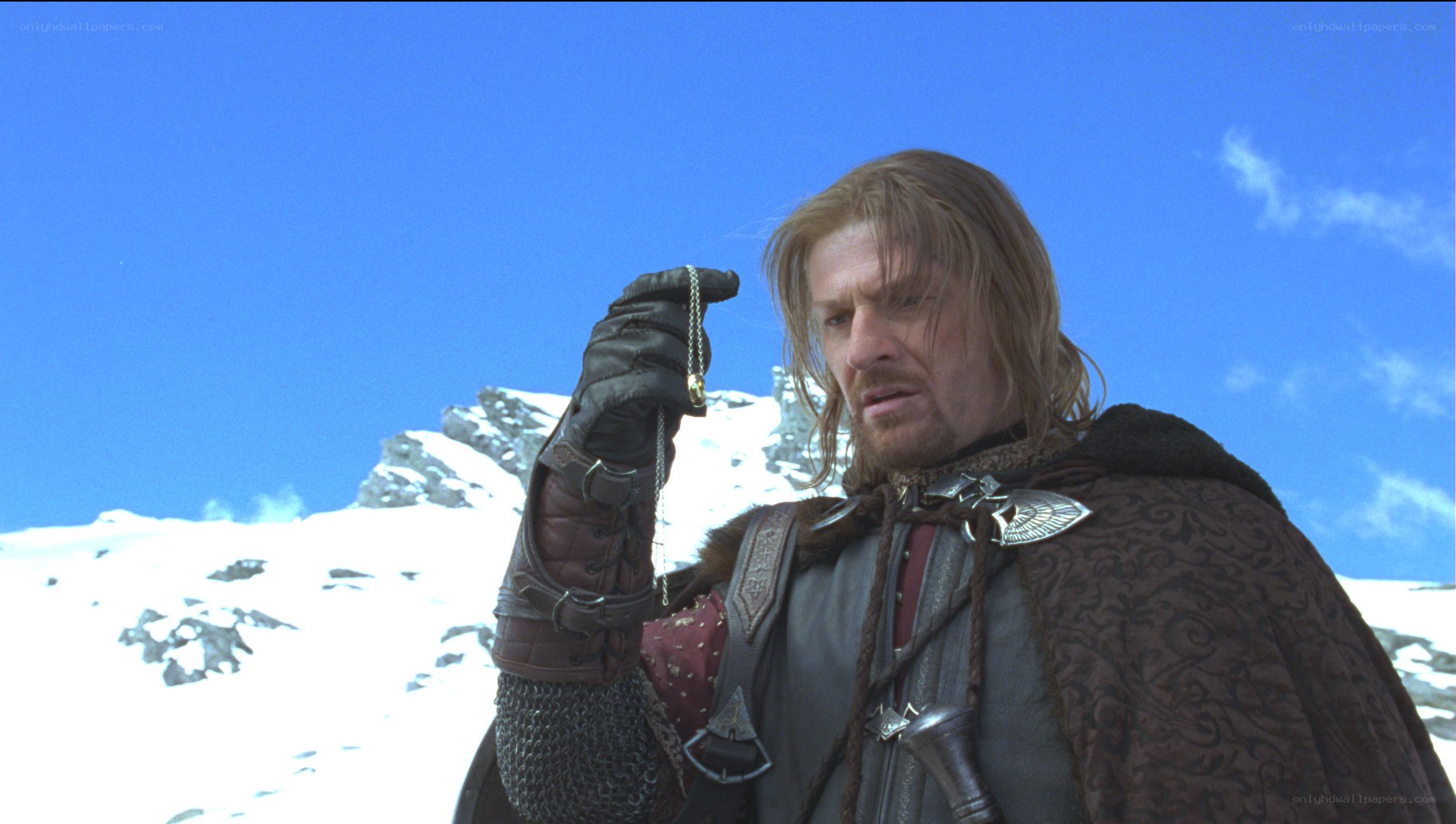 Aragorn holding a necklace