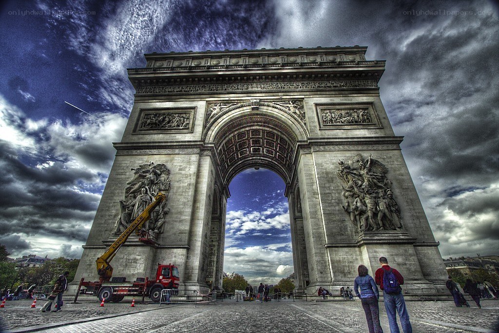 Arc de Triomphe under dramatic sky