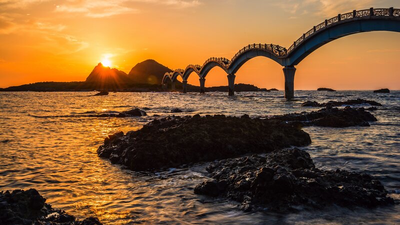 Arched Bridge at Sunset — Orange, Serene