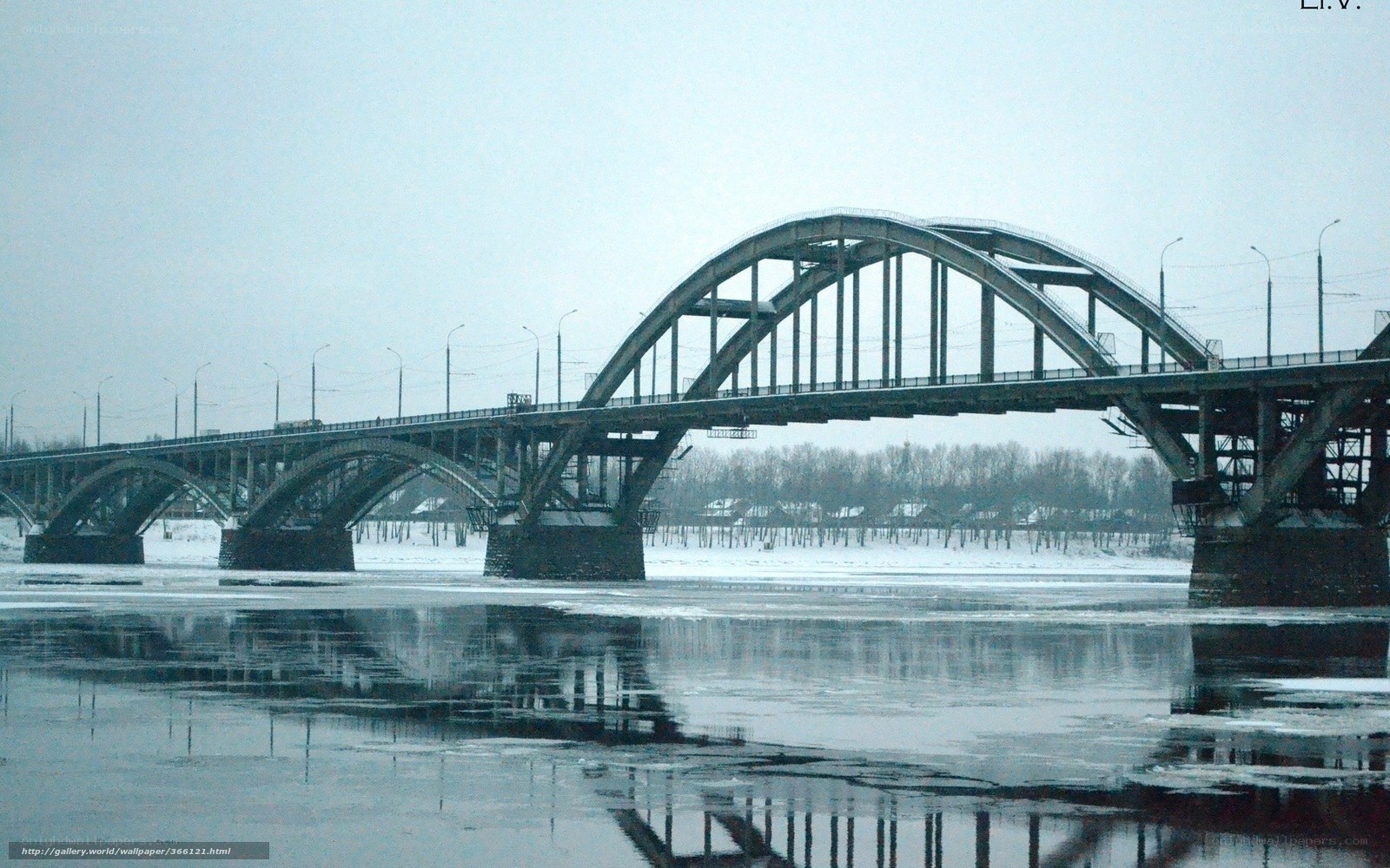 Arched bridge over frozen river