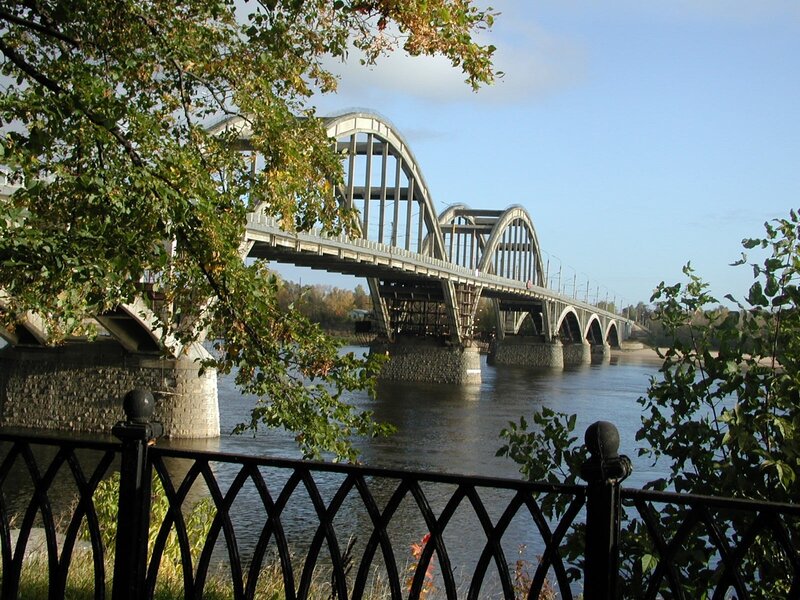 Arched bridge over river