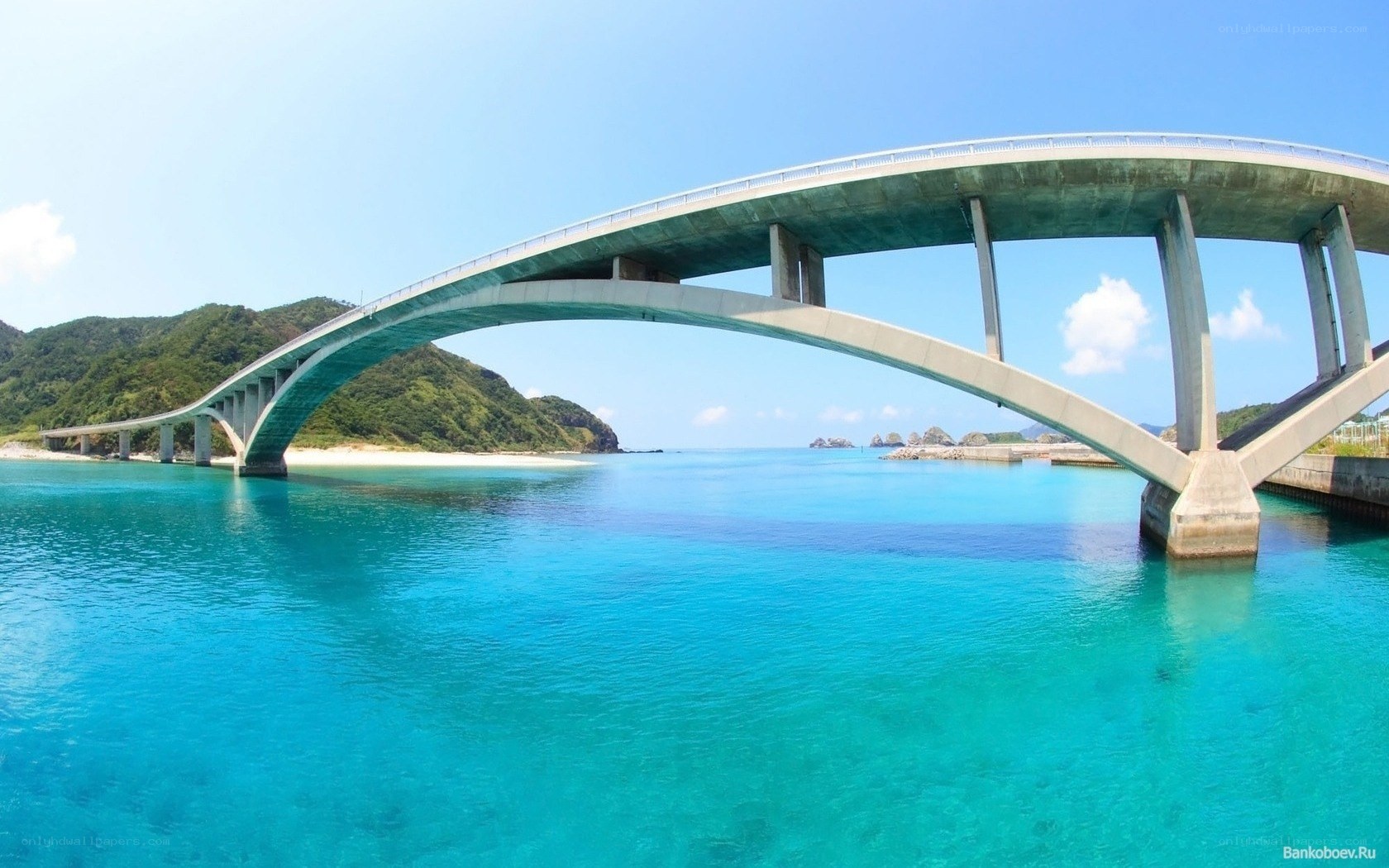 Arched bridge over turquoise water