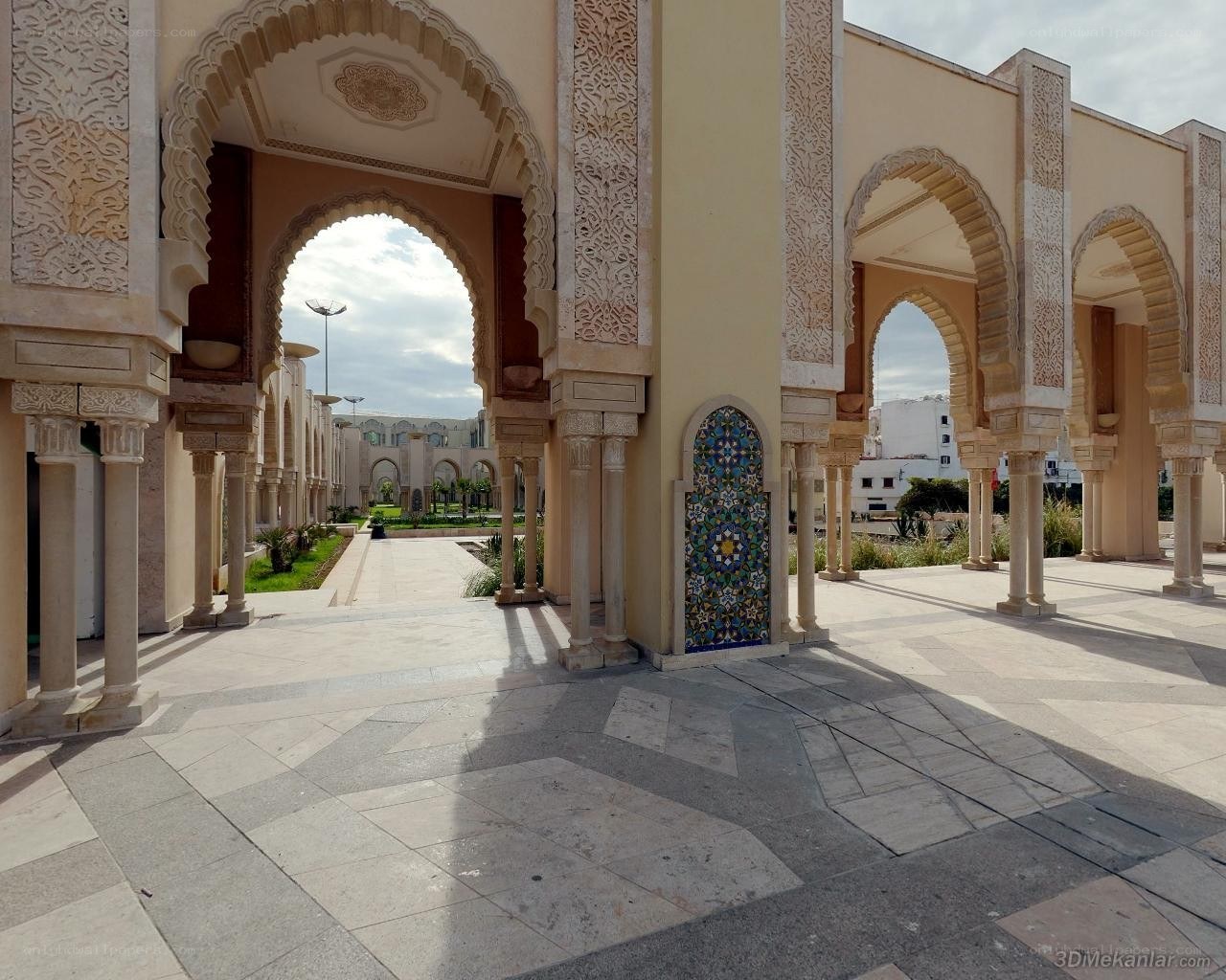 arched colonnade with tile mosaic