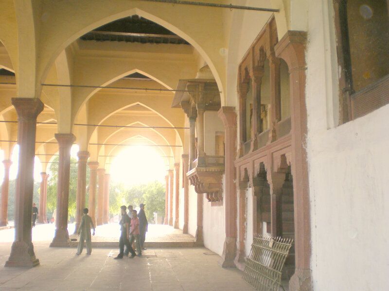 arched corridor with people