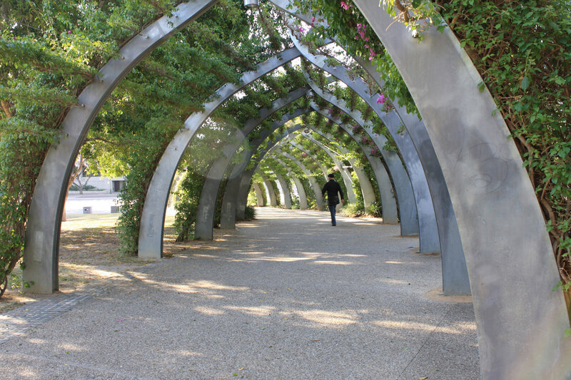 Arched walkway with greenery