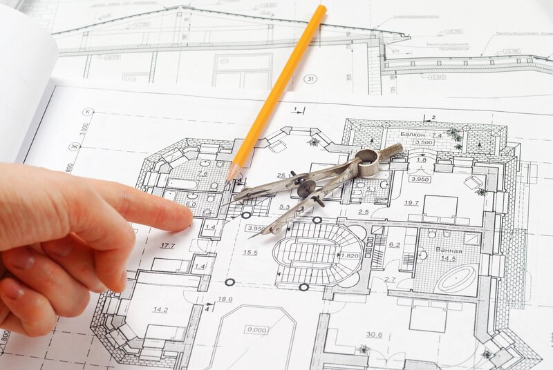 Architect reviewing blueprints