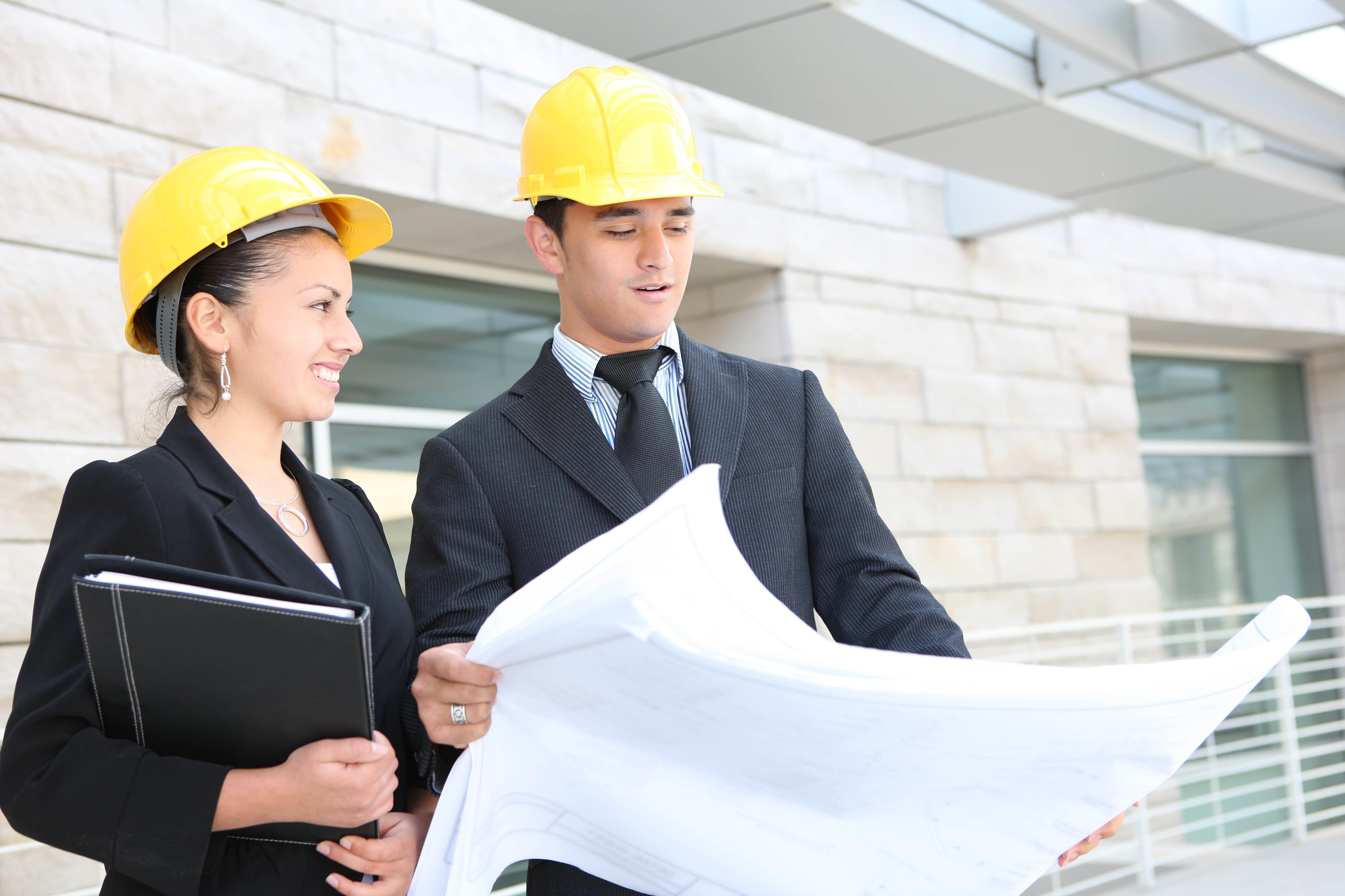 Architects reviewing blueprints