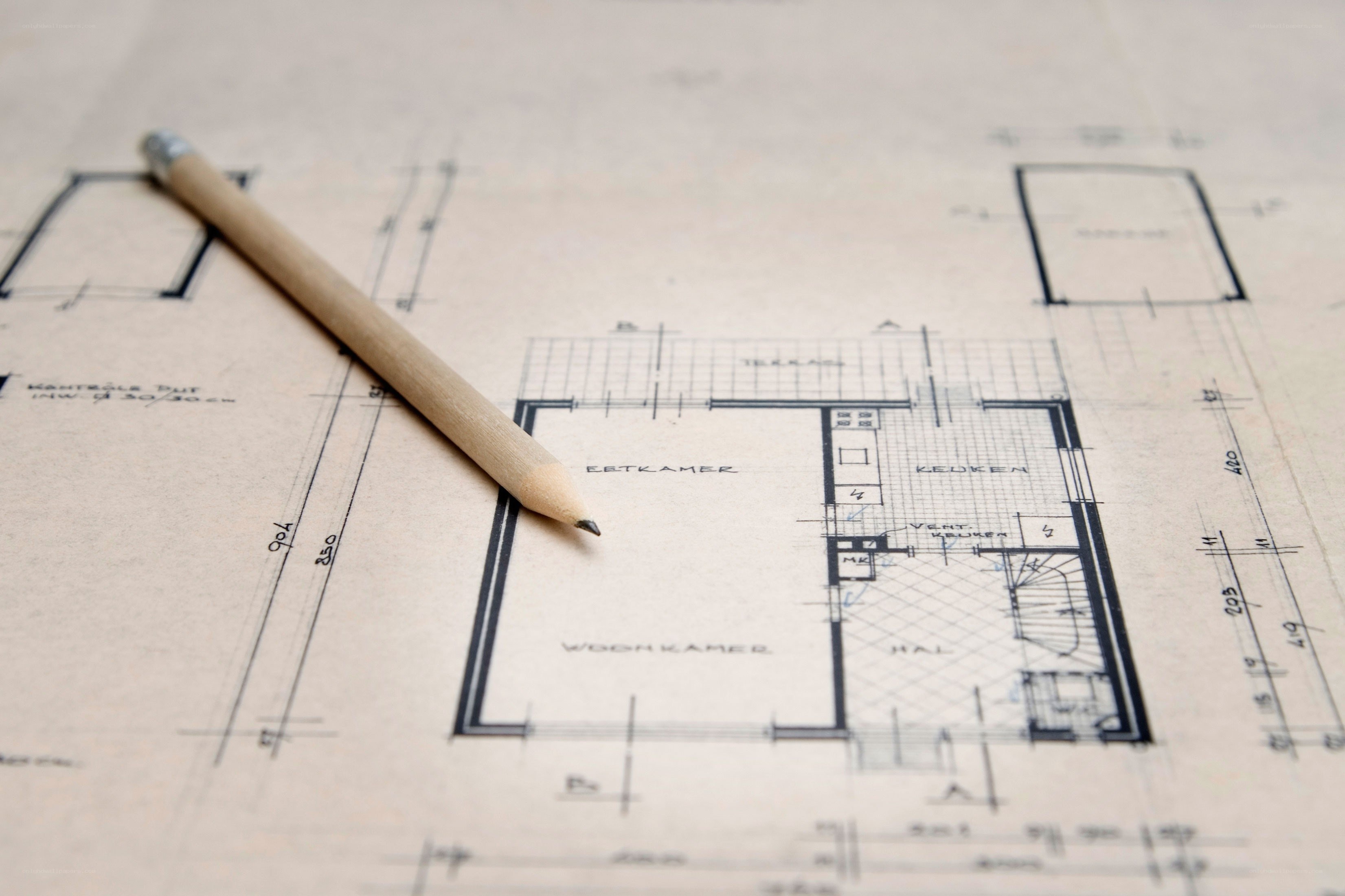 Architectural blueprint with pencil