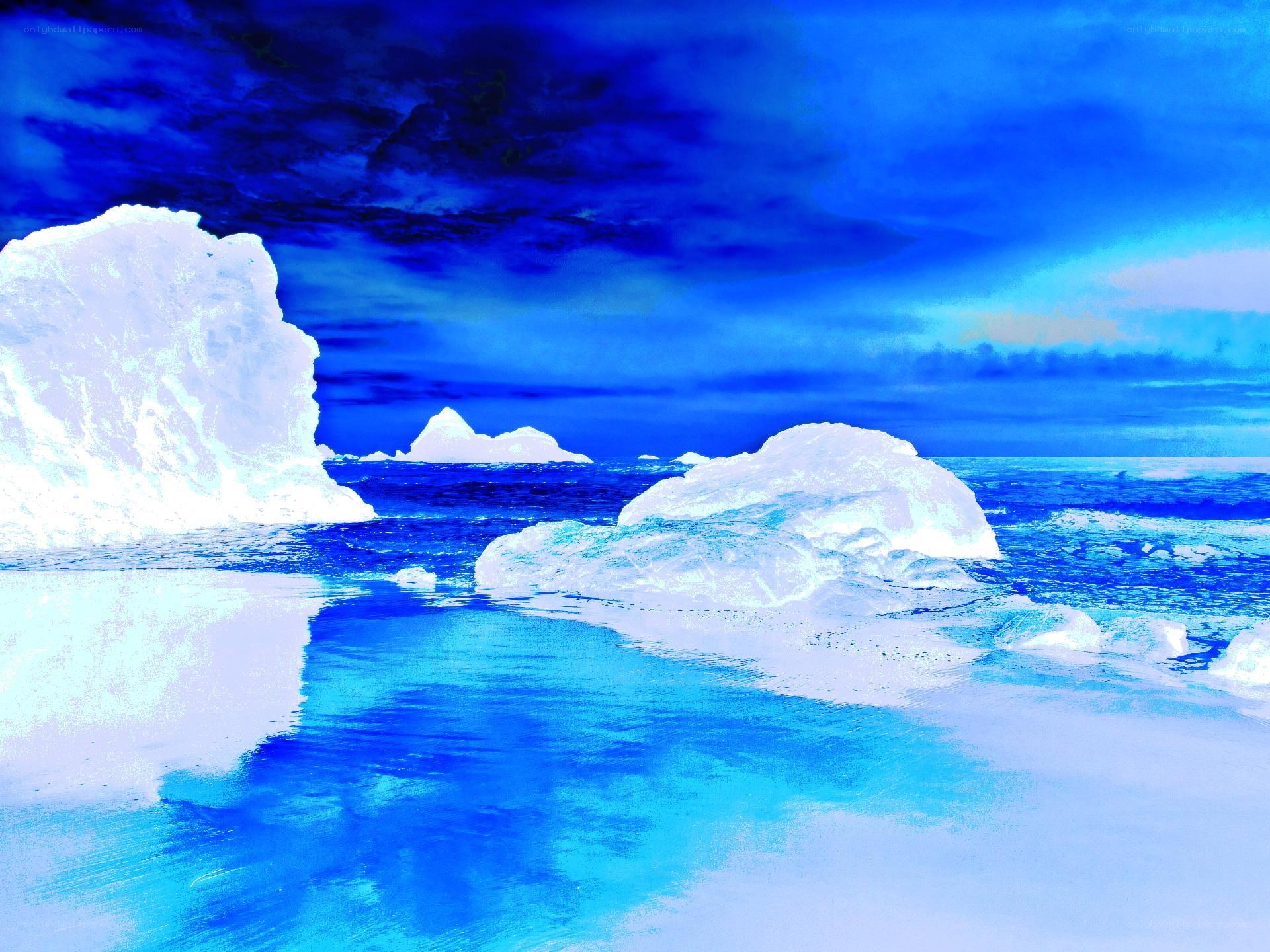 Arctic icebergs in blue waters