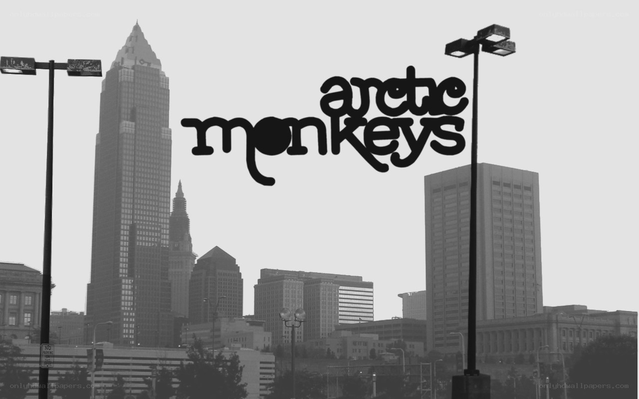 Arctic Monkeys logo over city