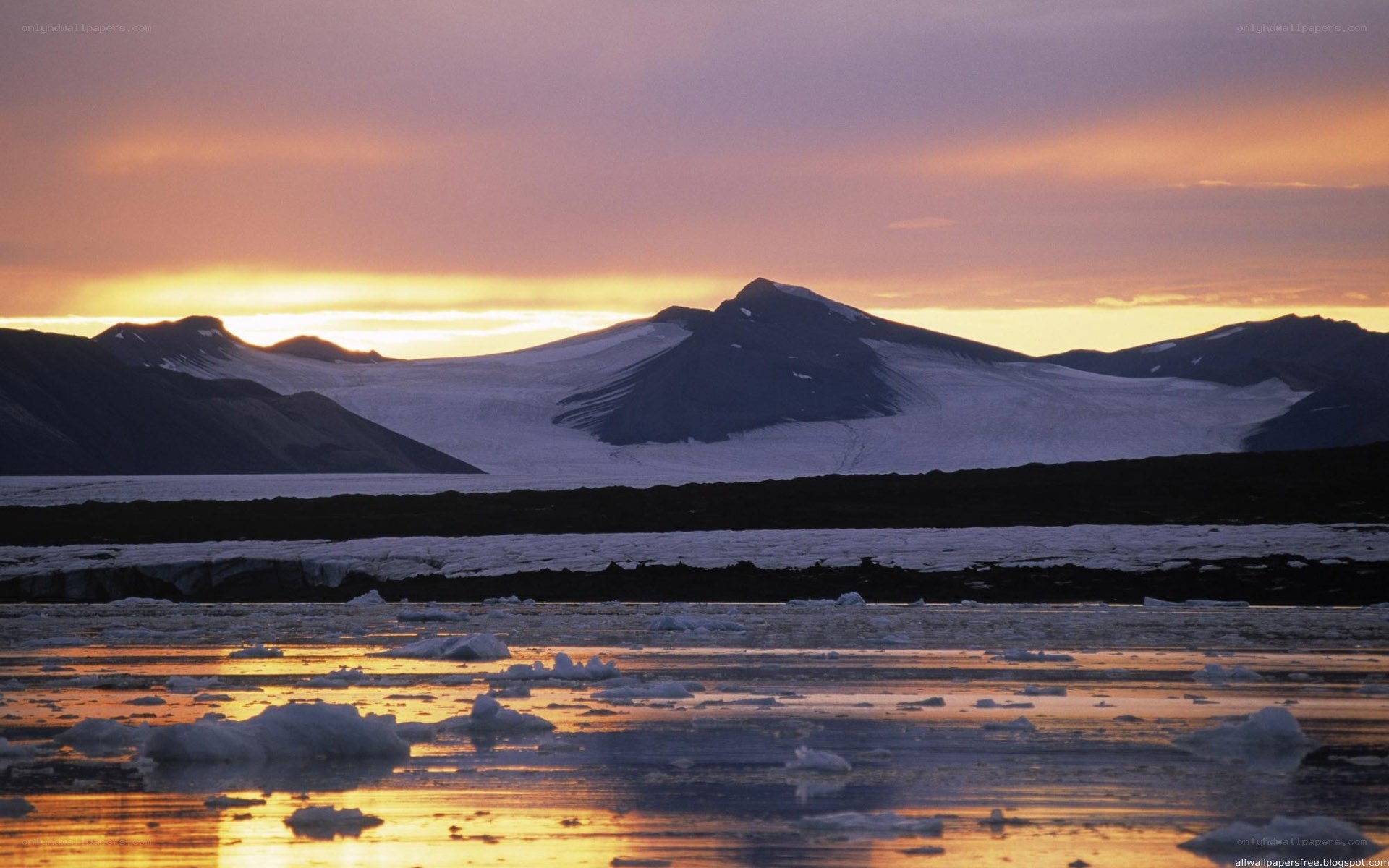 Arctic sunset over ice and mountains