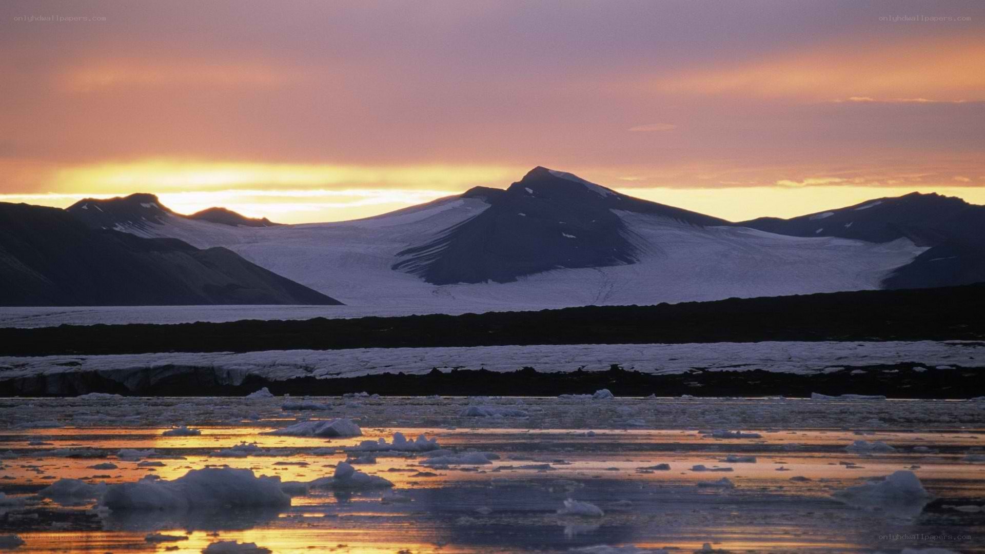 Arctic sunset over ice and mountains