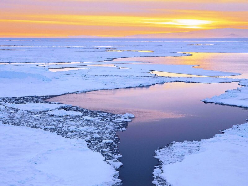 Arctic sunset over ice floes
