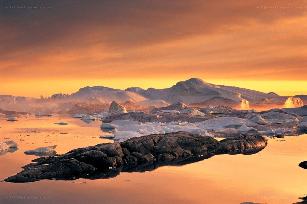 Arctic sunset with icebergs