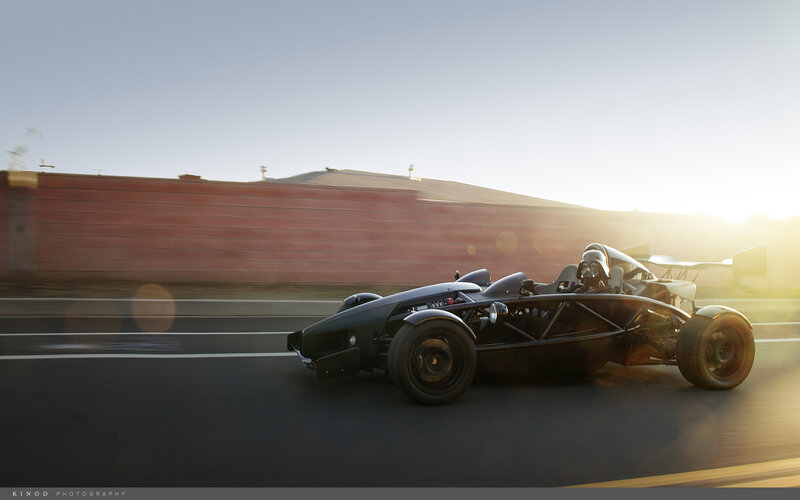 Ariel Atom racing at sunset
