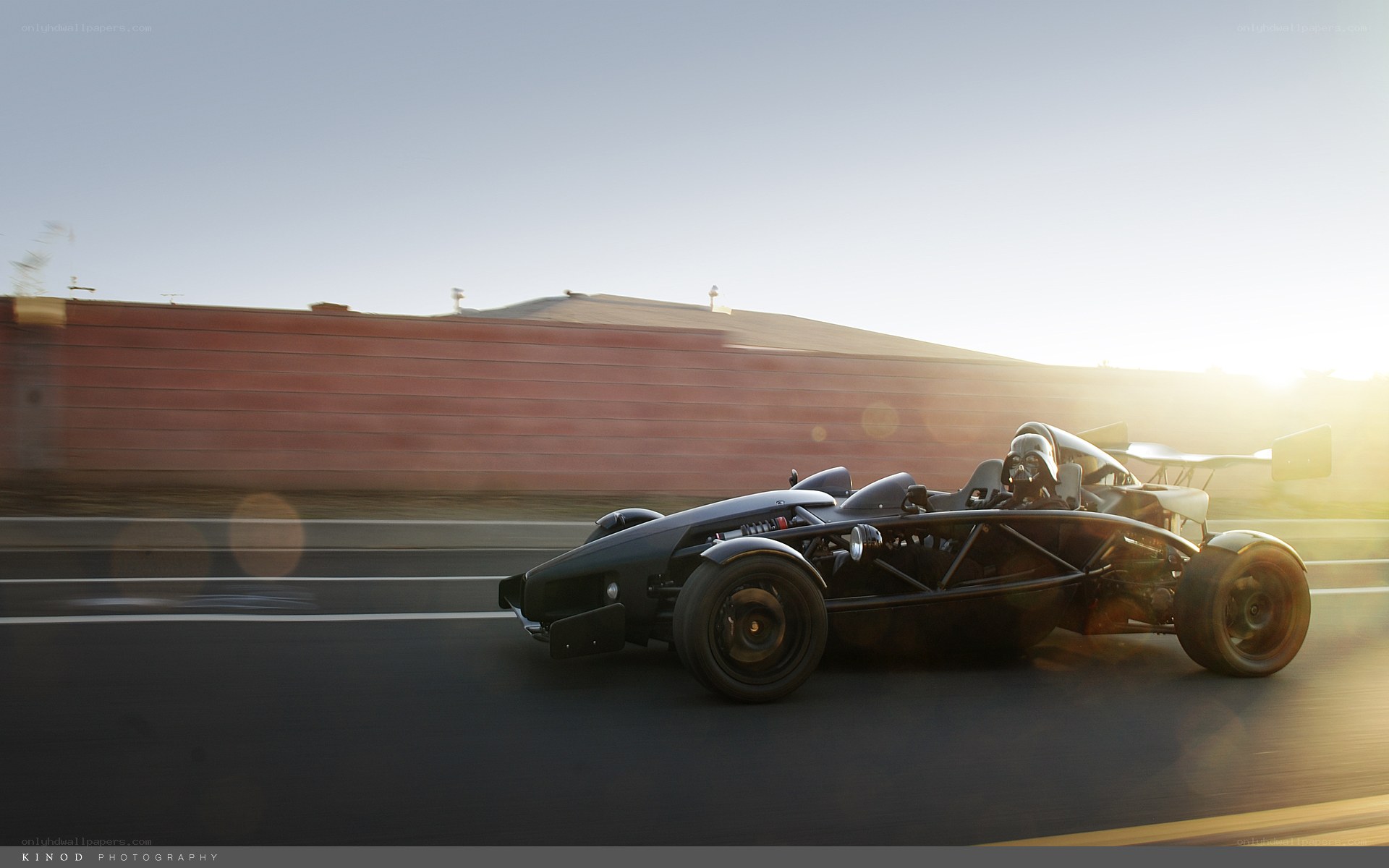 Ariel Atom racing at sunset