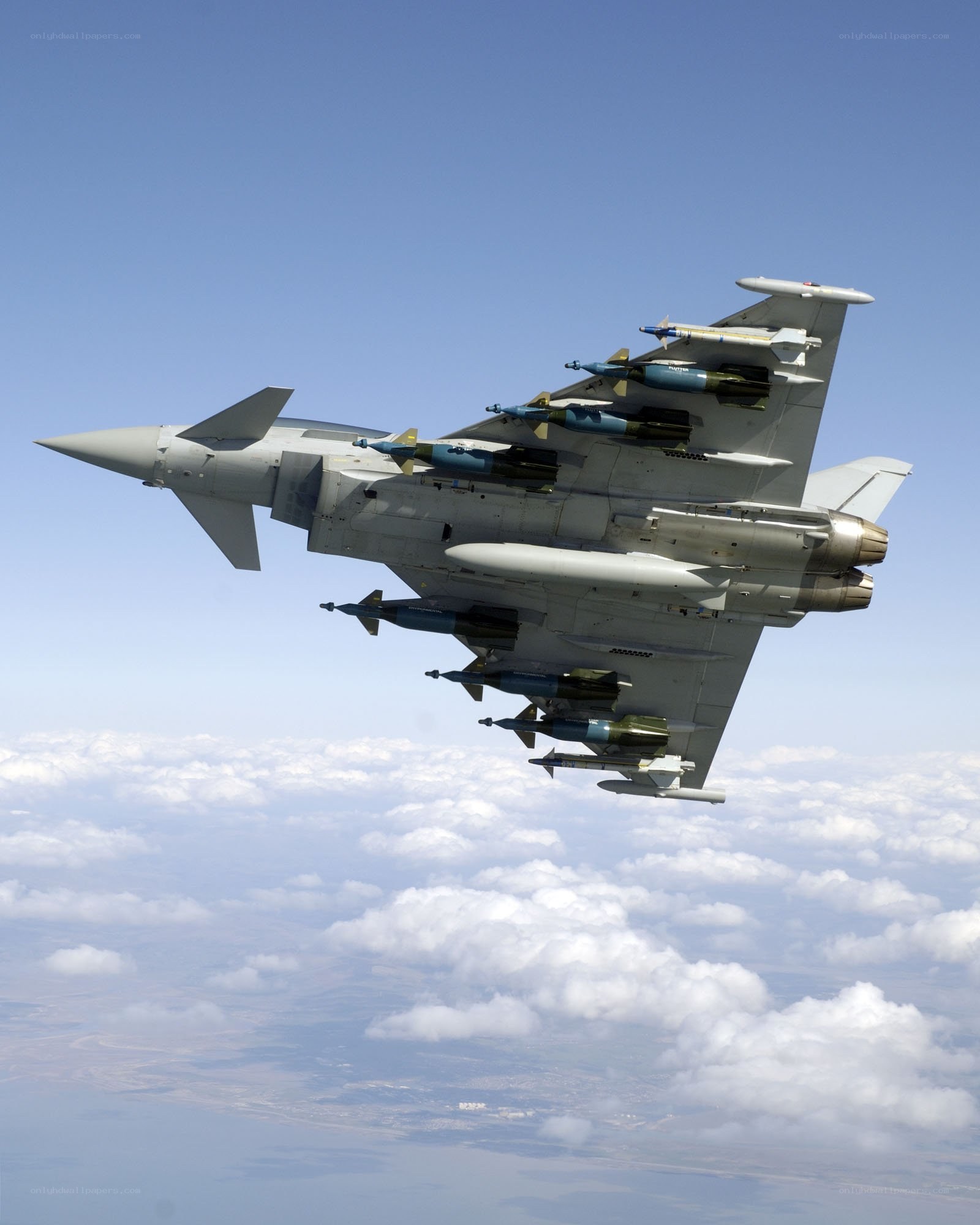 armed fighter jet in flight