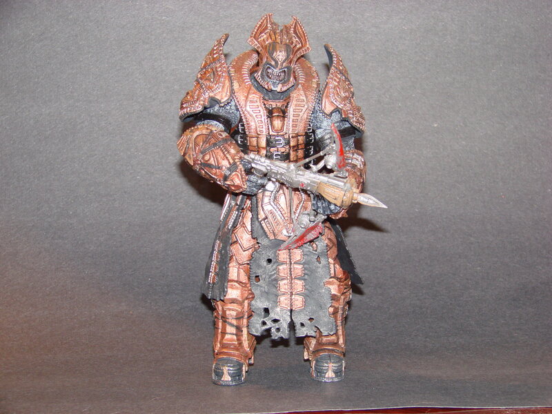 armored action figure with weapon