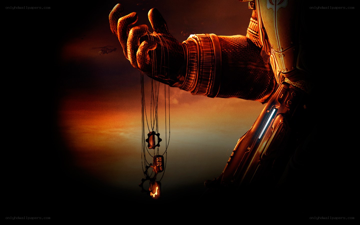 armored hand holding amulets
