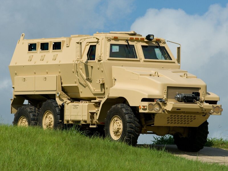 armored military vehicle on grass