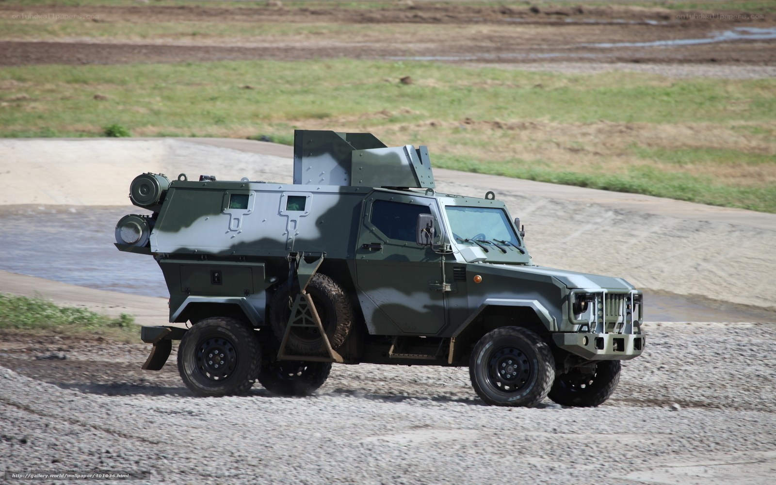 armored military vehicle on gravel