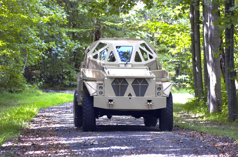 armored vehicle on forest path