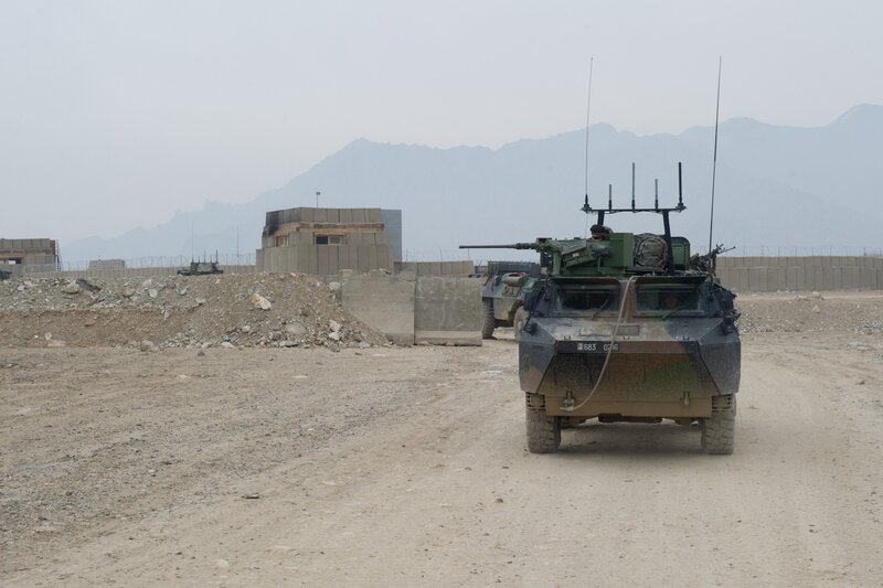 Armored Vehicles on Dirt Road — Brown