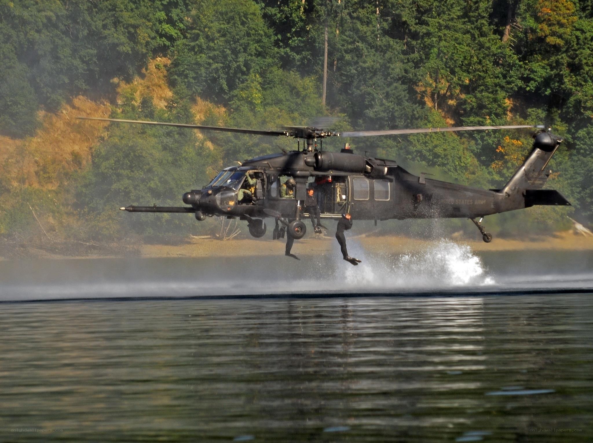 Army helicopter landing on water