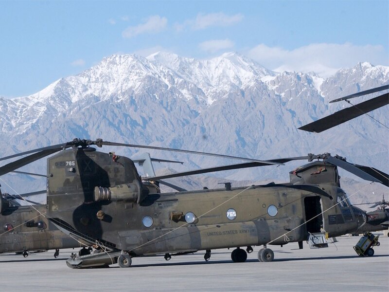 Army helicopters at mountain airfield