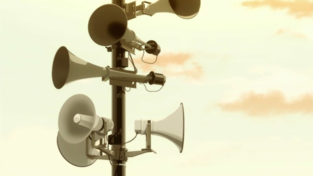 array of loudspeakers on pole