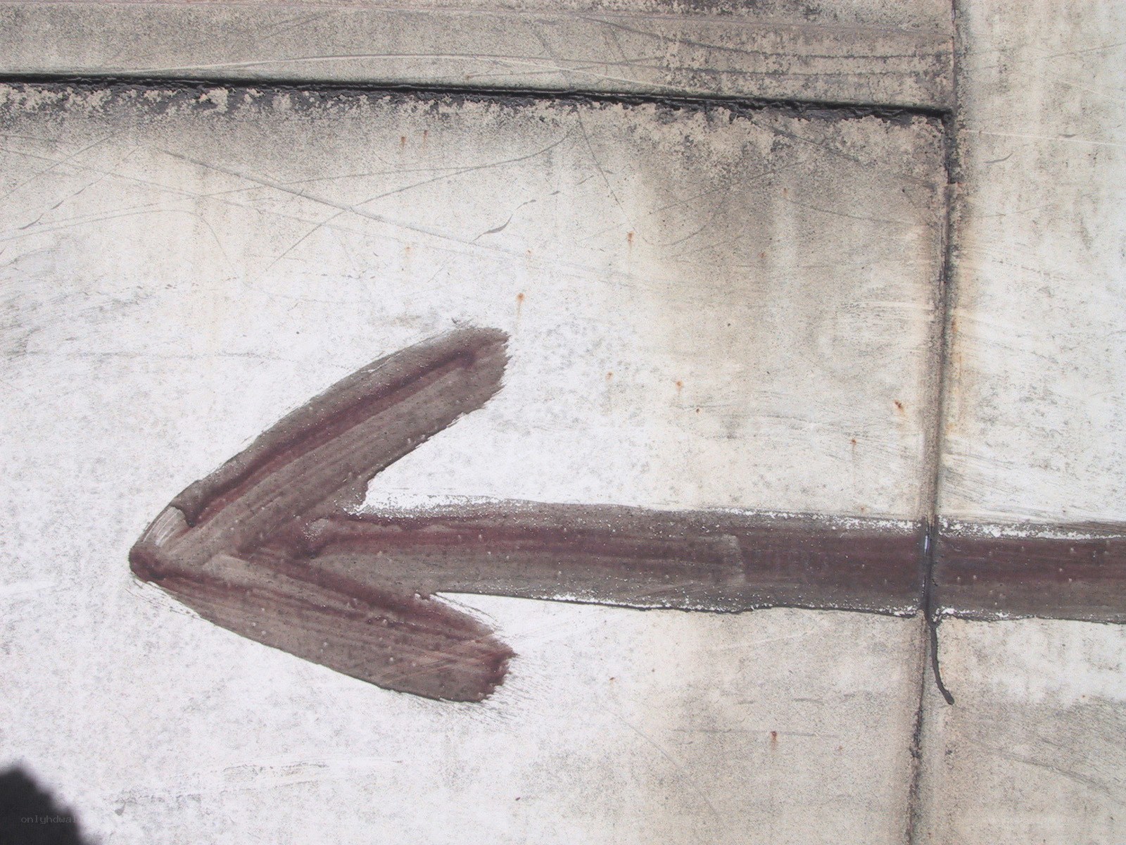 arrow painted on concrete