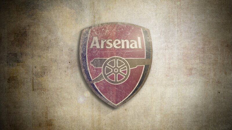 Arsenal FC crest on textured background