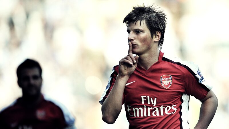 Arsenal football player in red jersey