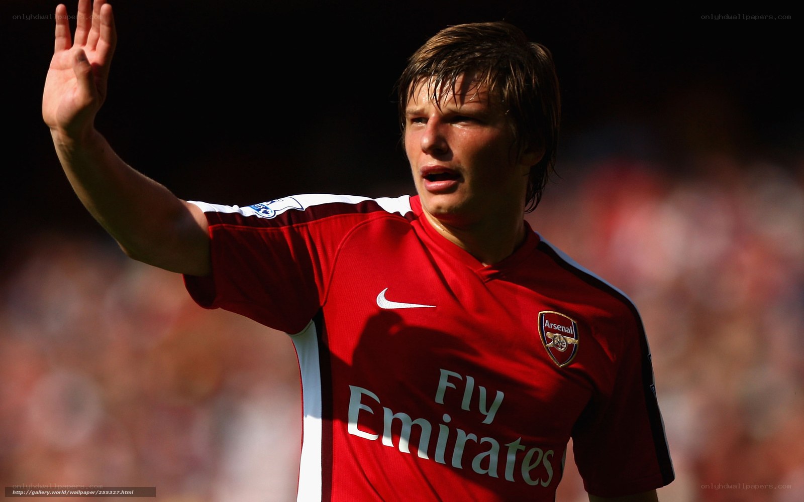 Arsenal football player waving