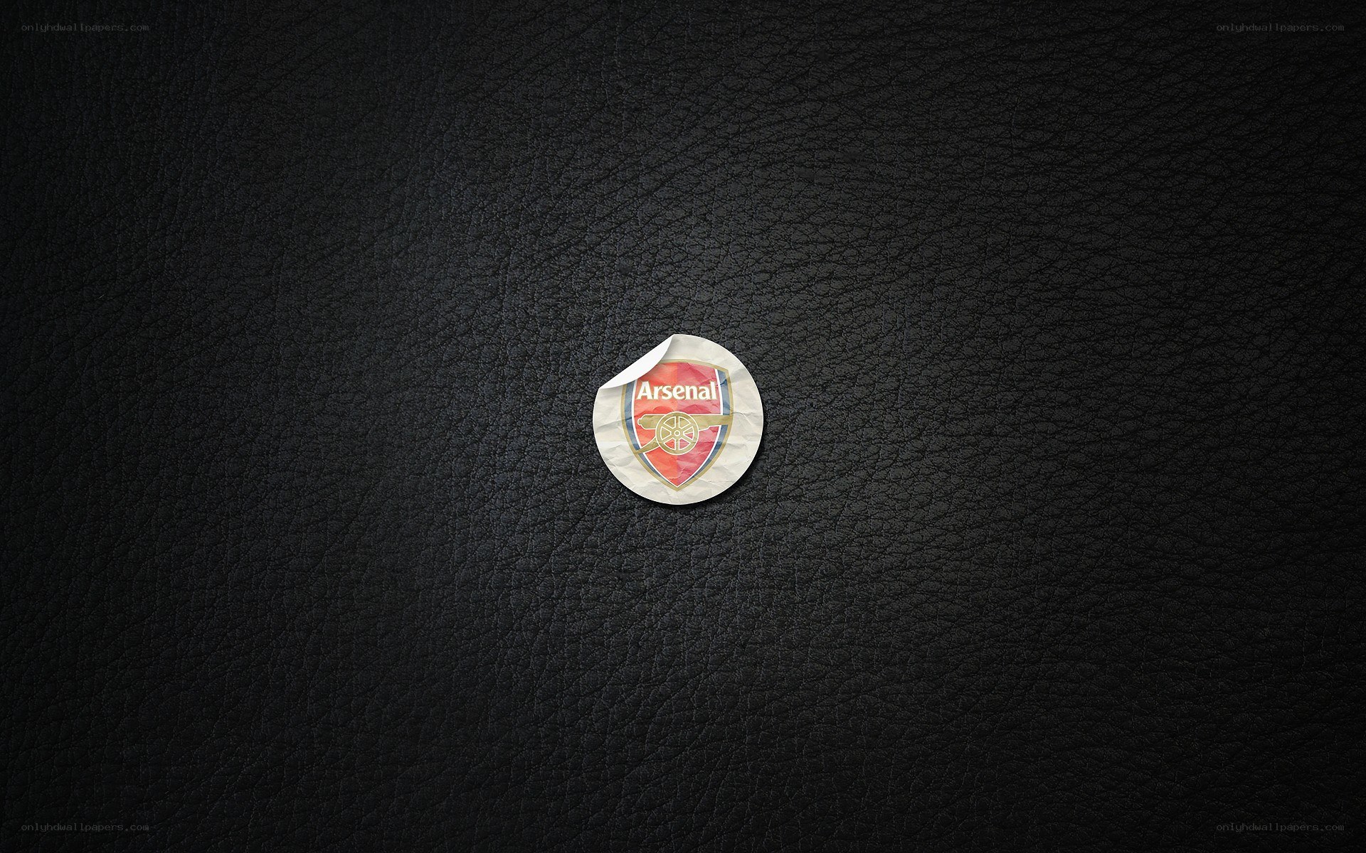 Arsenal logo sticker on leather