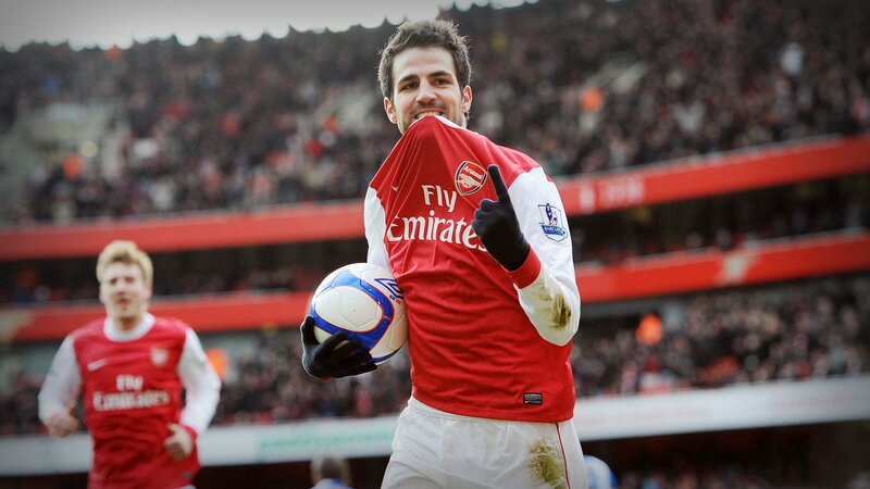 Arsenal player celebrates with ball