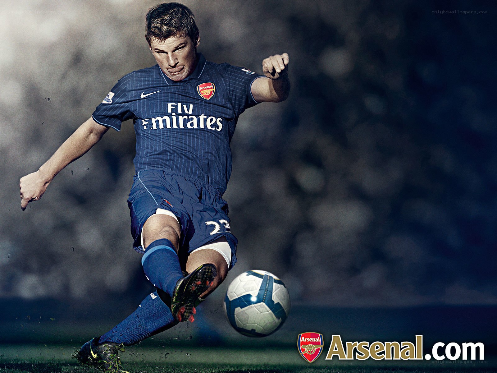 Arsenal player kicking ball