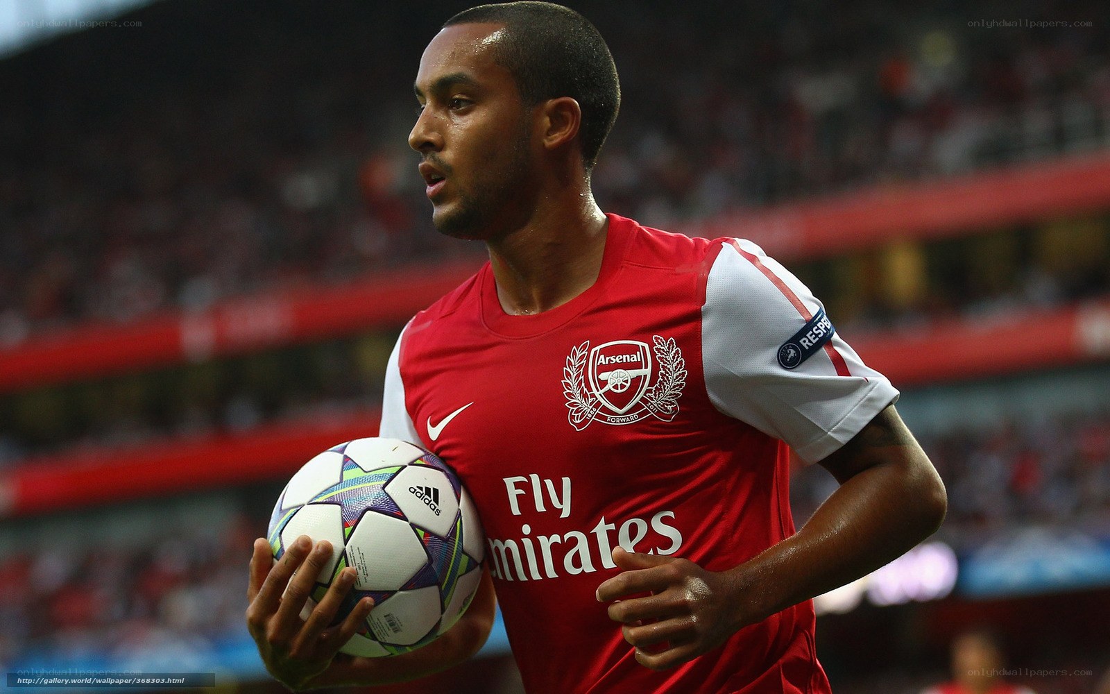 Arsenal player with football