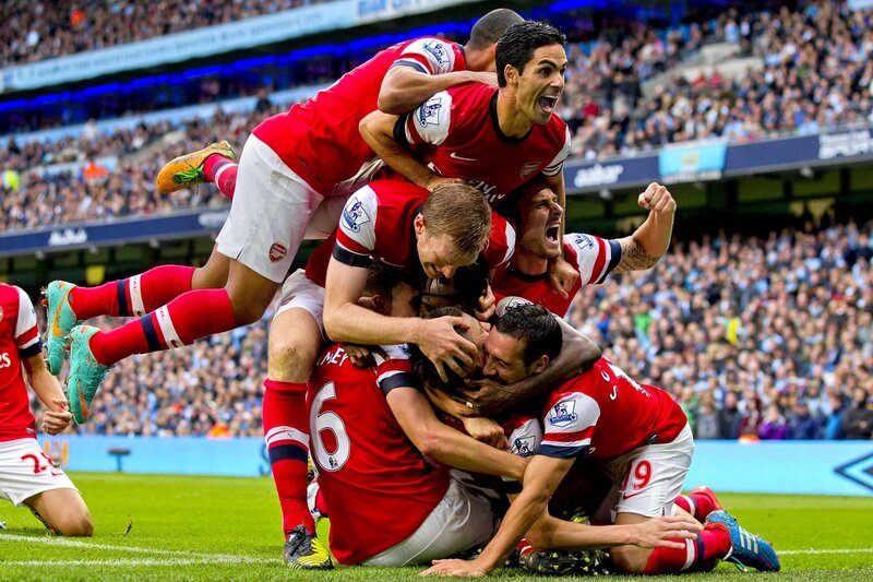 Arsenal players celebrate a goal
