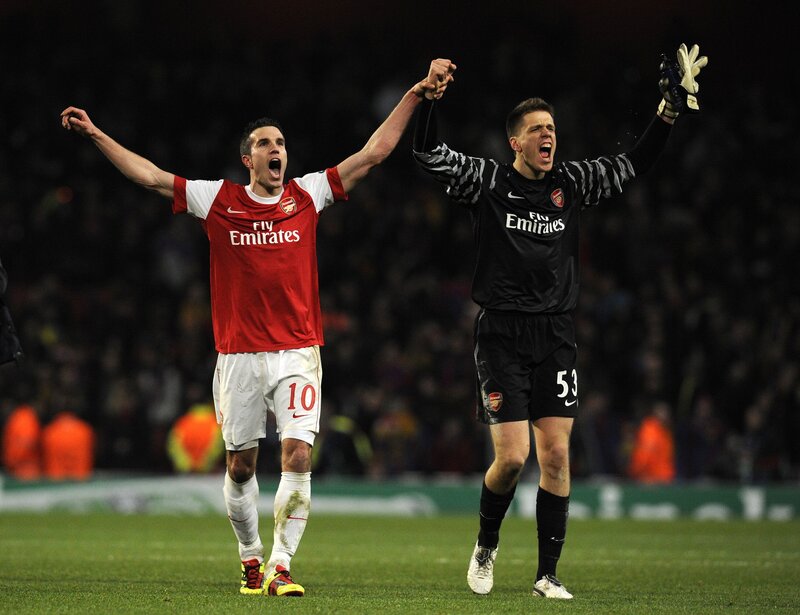 Arsenal players celebrate on field