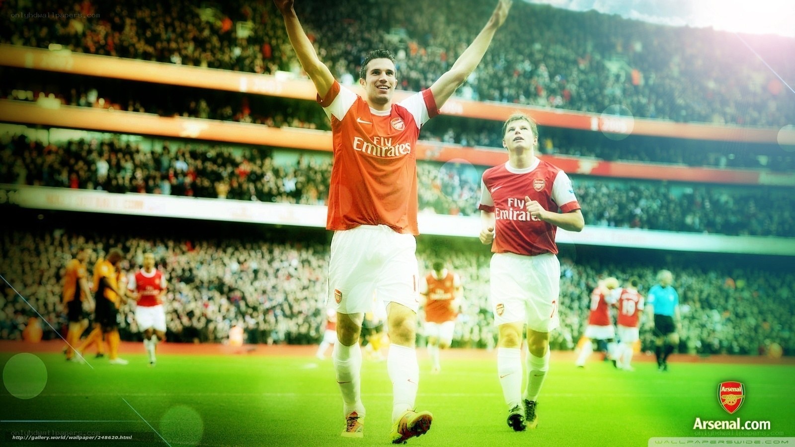 Arsenal players celebrate on field