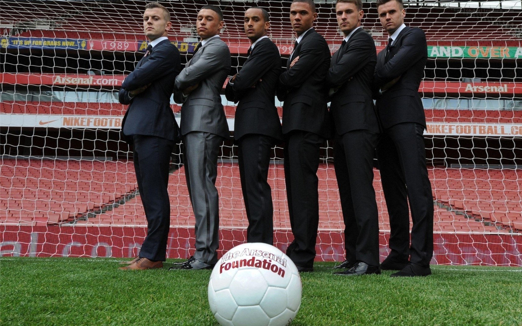 Arsenal players in suits