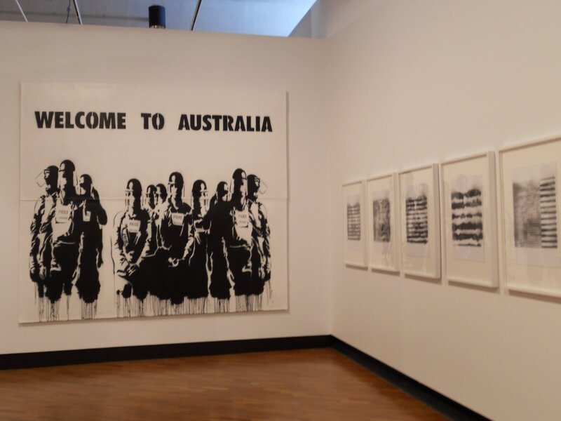 Art exhibit with 'Welcome to Australia' piece