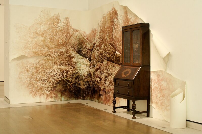 Art installation with cabinet and mural