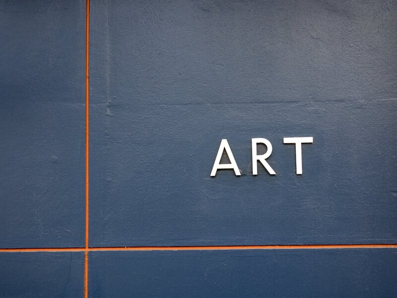 Art sign on blue wall