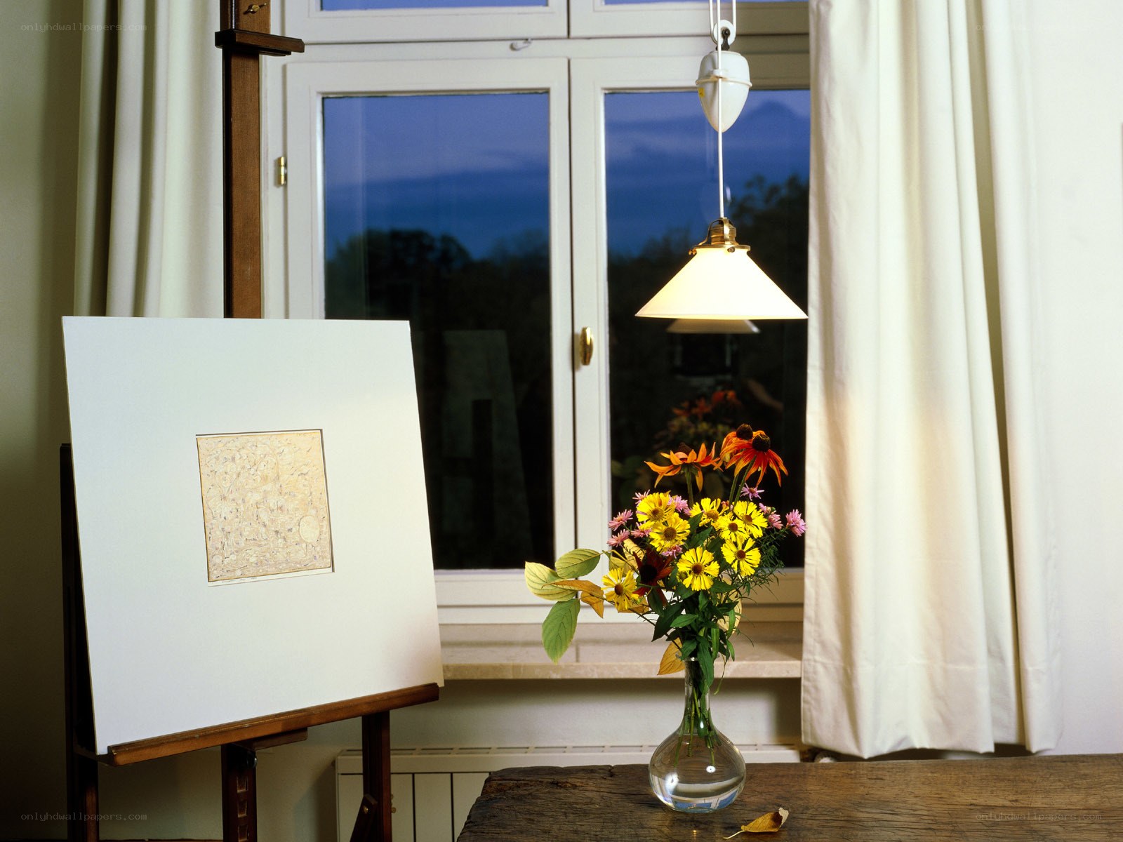 Art studio with flowers and lamp