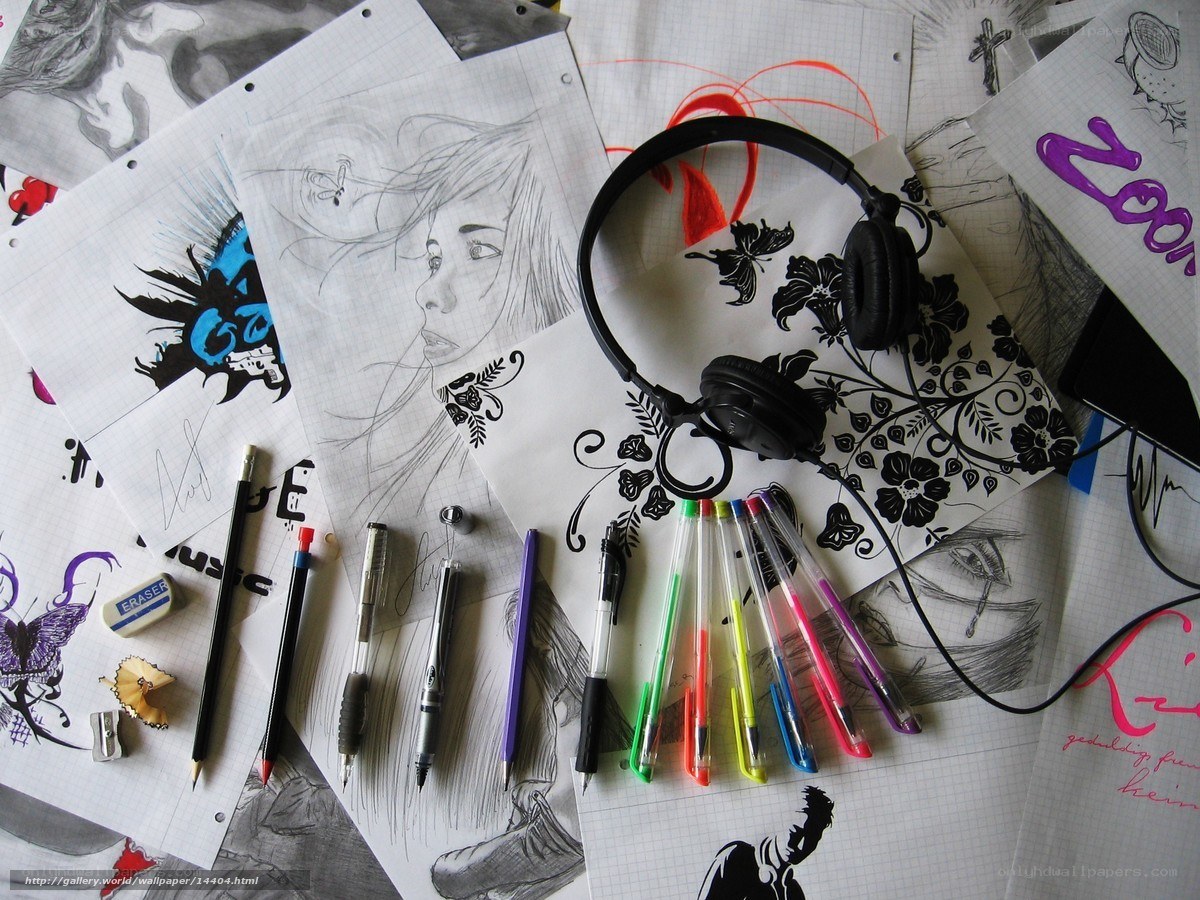 Art supplies and sketches on desk